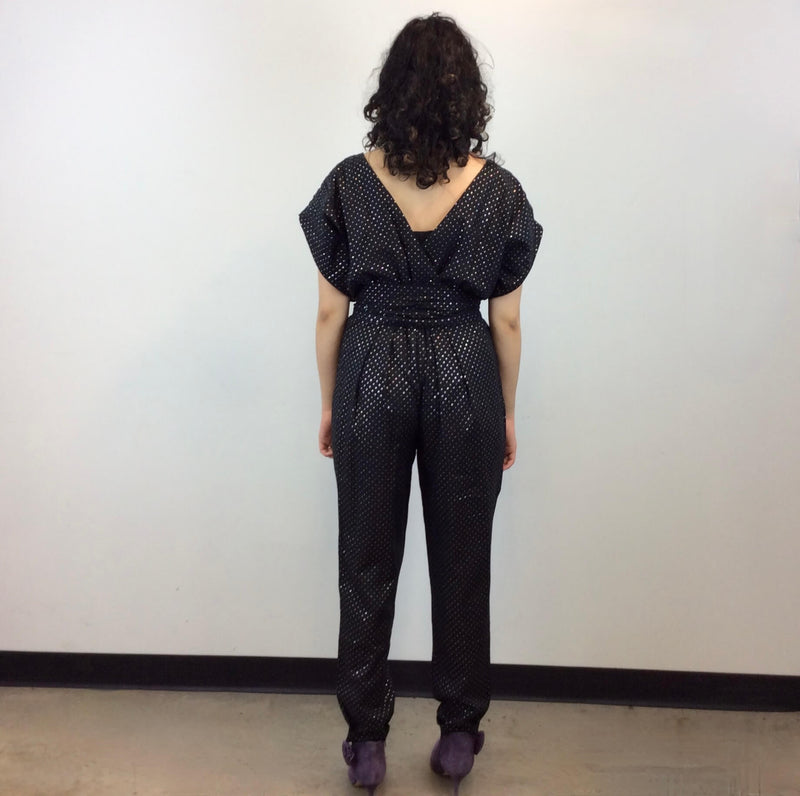 Back view of 1980s Gold Dotted Black Jumpsuit Size Small-Medium sold at bohemevintage.com Montreal