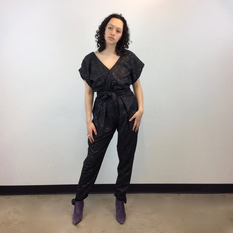  Front view of 1980s Gold Dotted Black Jumpsuit Size Small-Medium sold at bohemevintage.com Montreal