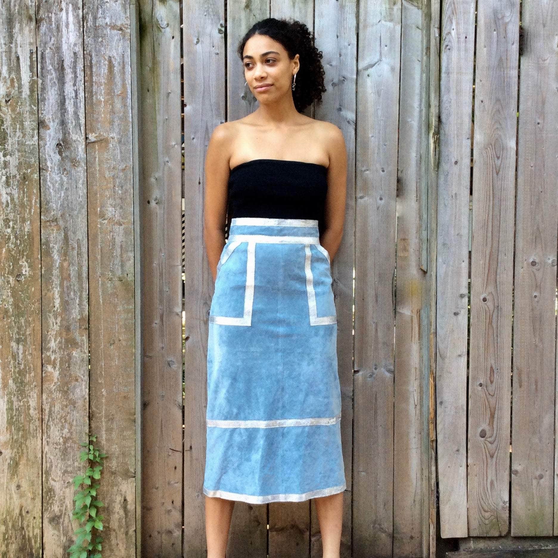 Front View of Boheme Vintage 1990s Y2K baby blue suede midi skirt with silver leather trim and patch pockets.