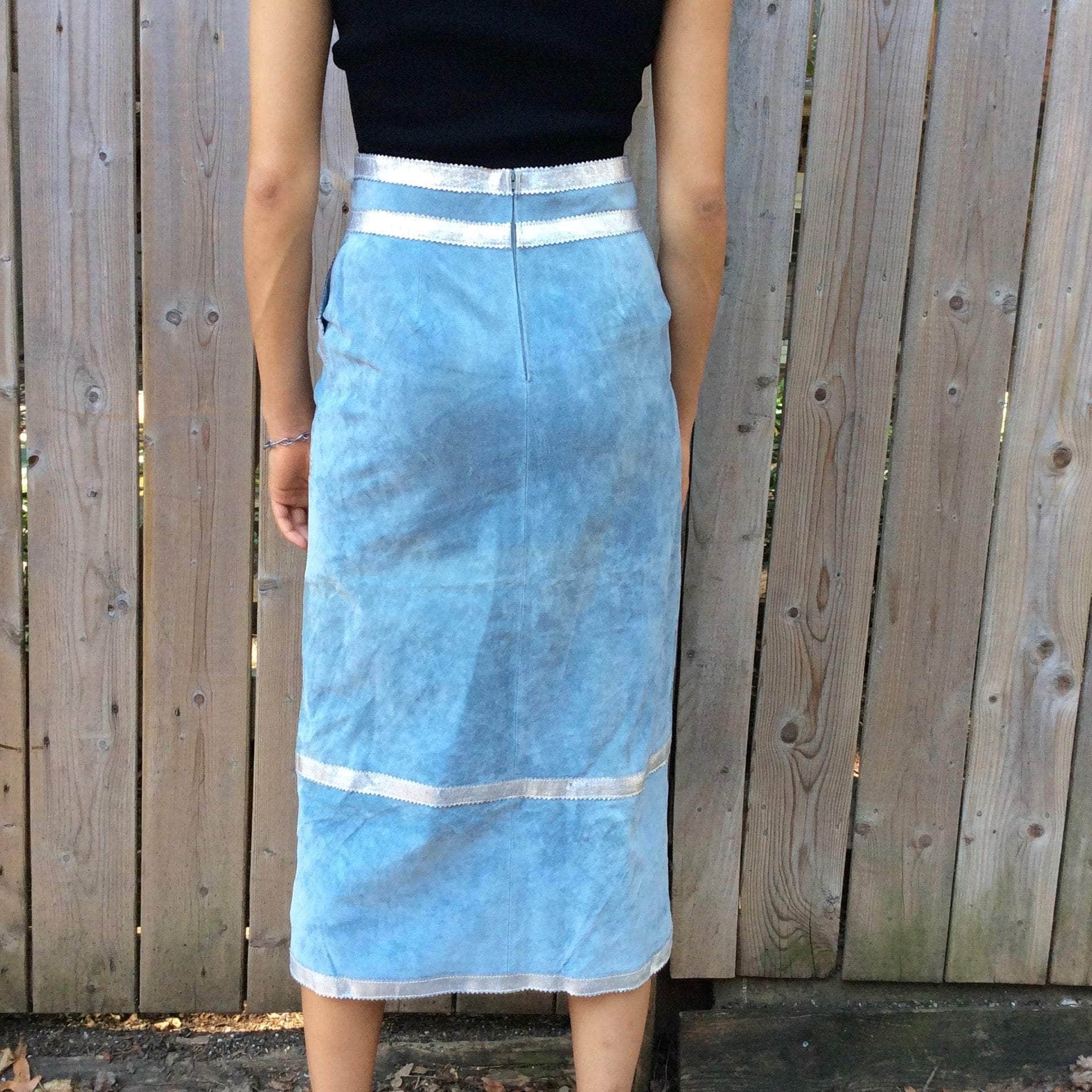 Close up back view of Boheme Vintage 1990s Y2K baby blue suede midi skirt with silver leather trim and patch pockets.