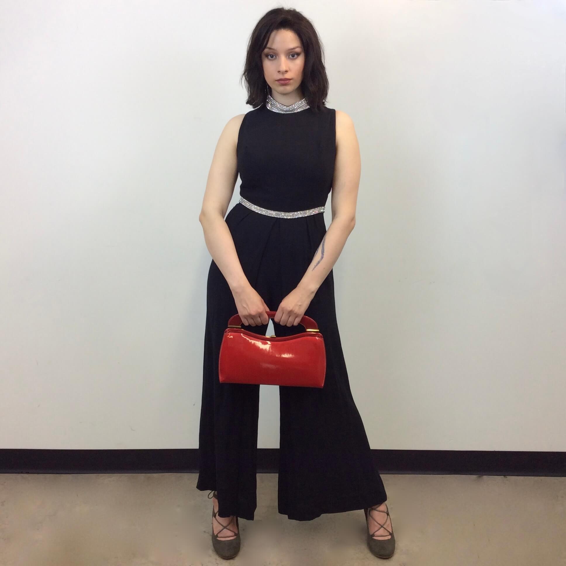 Front view of 1960s Wide Leg Black Evening Jumpsuit Size Medium sold at bohemevintage.com Montreal