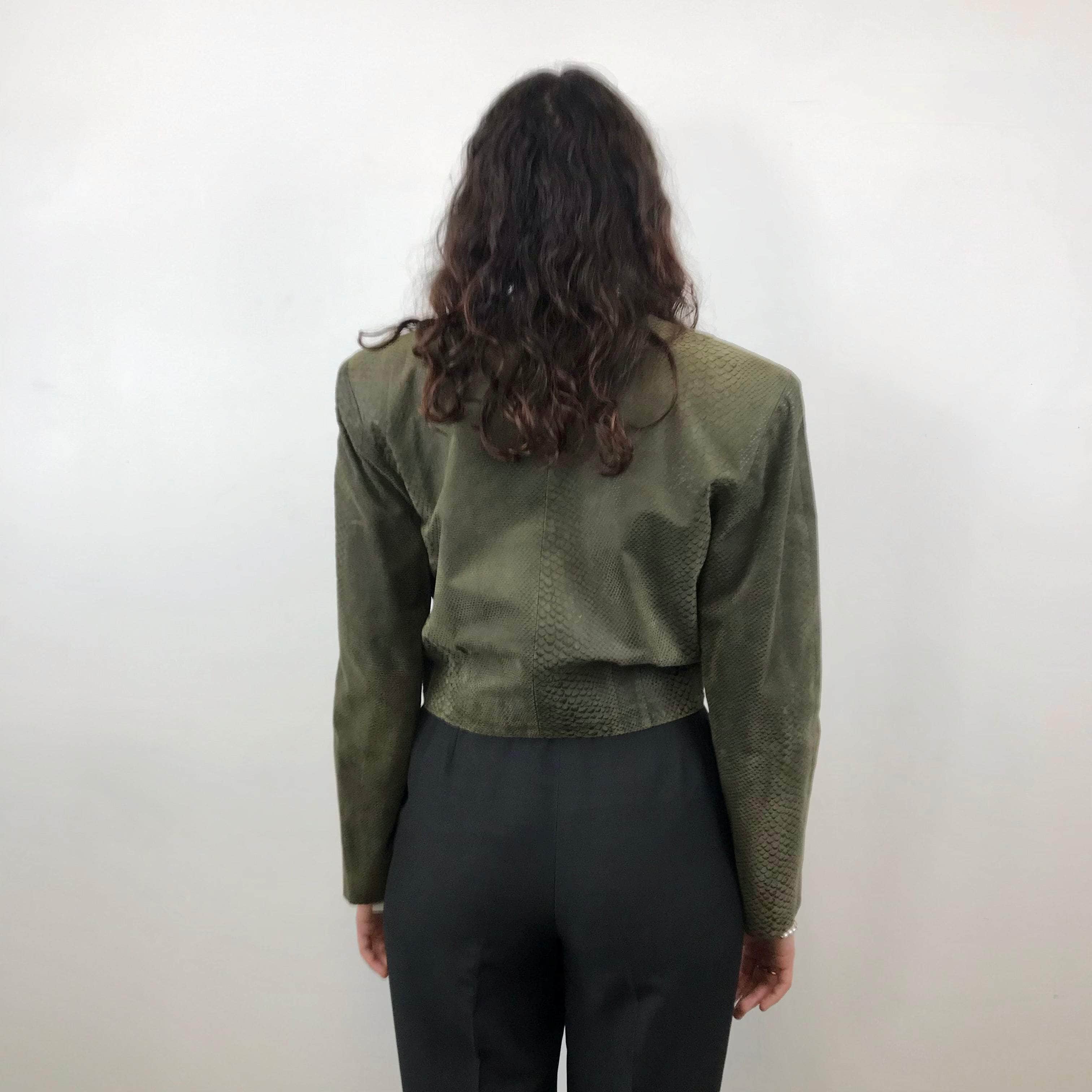 Back view of 1980s Danier Cropped Leather Jacket size Medium sold at bohemevintage.com Montreal