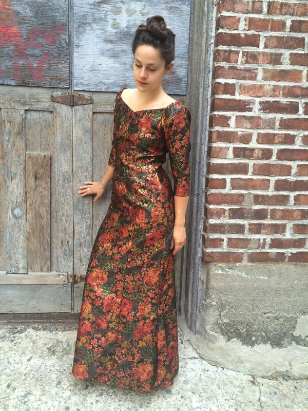 Front View of 1970s Off-the-Shoulder Metallic Brocade Gown Size Small/Medium sold at bohemevintage.com Montreal