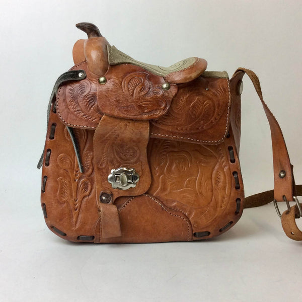 Front view of 1970's Saddle Tooled Leather Shoulder Bag  sold at bohemevintage.com