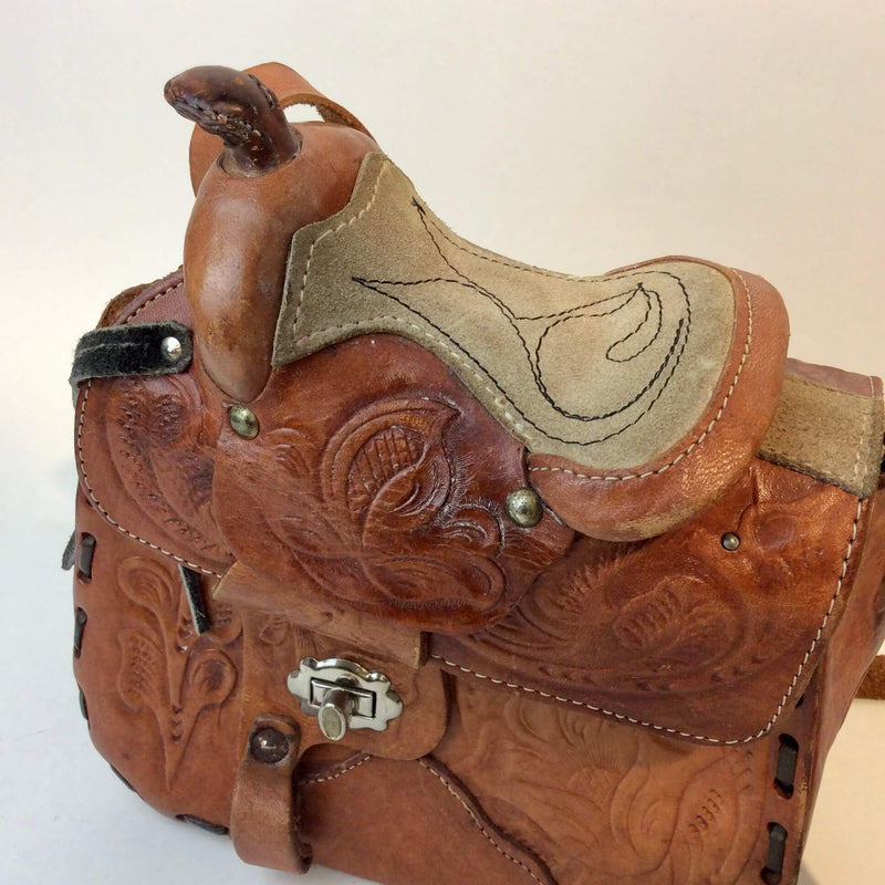 Close-up view of 1970's Saddle Tooled Leather Shoulder Bag sold at bohemevintage.com