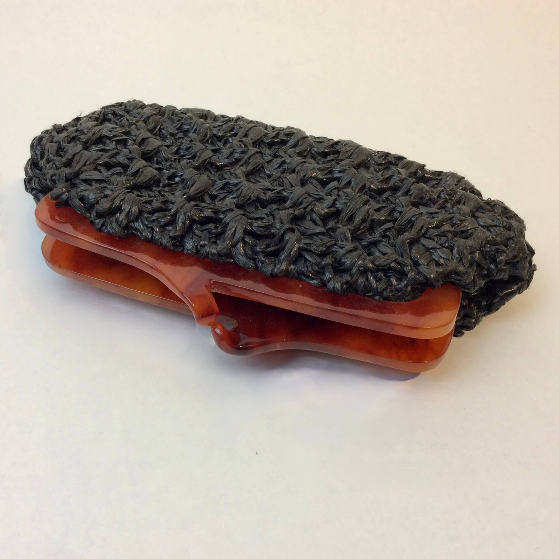 1960s Small Black Crocheted Raffia Evening Clutch sold at bohemevintage.com Montreal