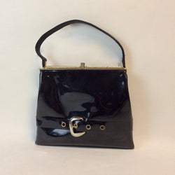 1950s-60s Black Patent Leather Handbag with Decorative Buckle Strap sold at bohemevintage.com Montreal