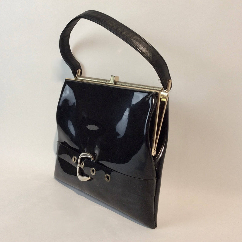 1950s-60s Black Patent Leather Handbag with Decorative Buckle Strap sold at bohemevintage.com Montreal