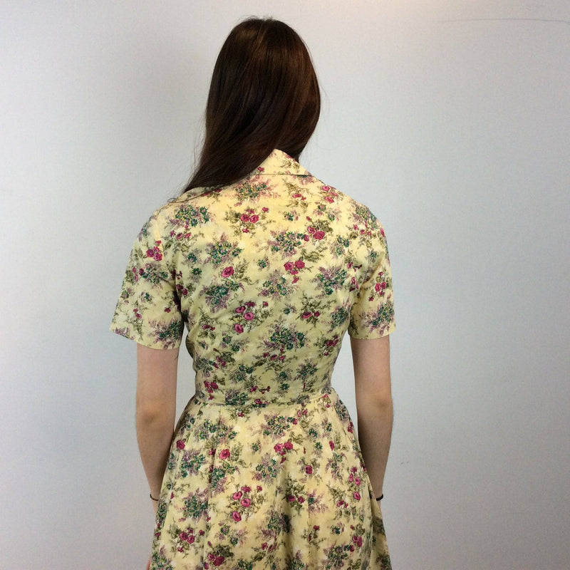 Back view of 1950s-60s Convertible two-piece Yellow Floral Print Cotton Dress and Bolero Jacket Set , Size Small sold by bohemevintage.com Montreal