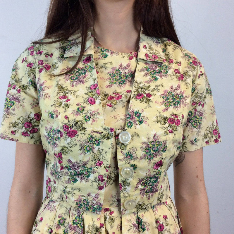 Close up view of front of 1950s-60s Convertible two-piece Yellow Floral Print Cotton Dress and Bolero Jacket Set , Size Small sold by bohemevintage.com Montreal