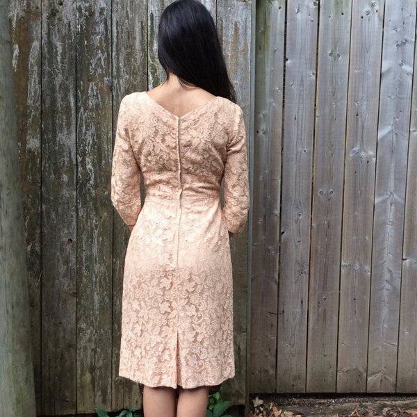 Back view of 1950s/60s Nude ¾ Sleeve Lace Cocktail Dress Size Small sold by bohemevintage.com Montréal