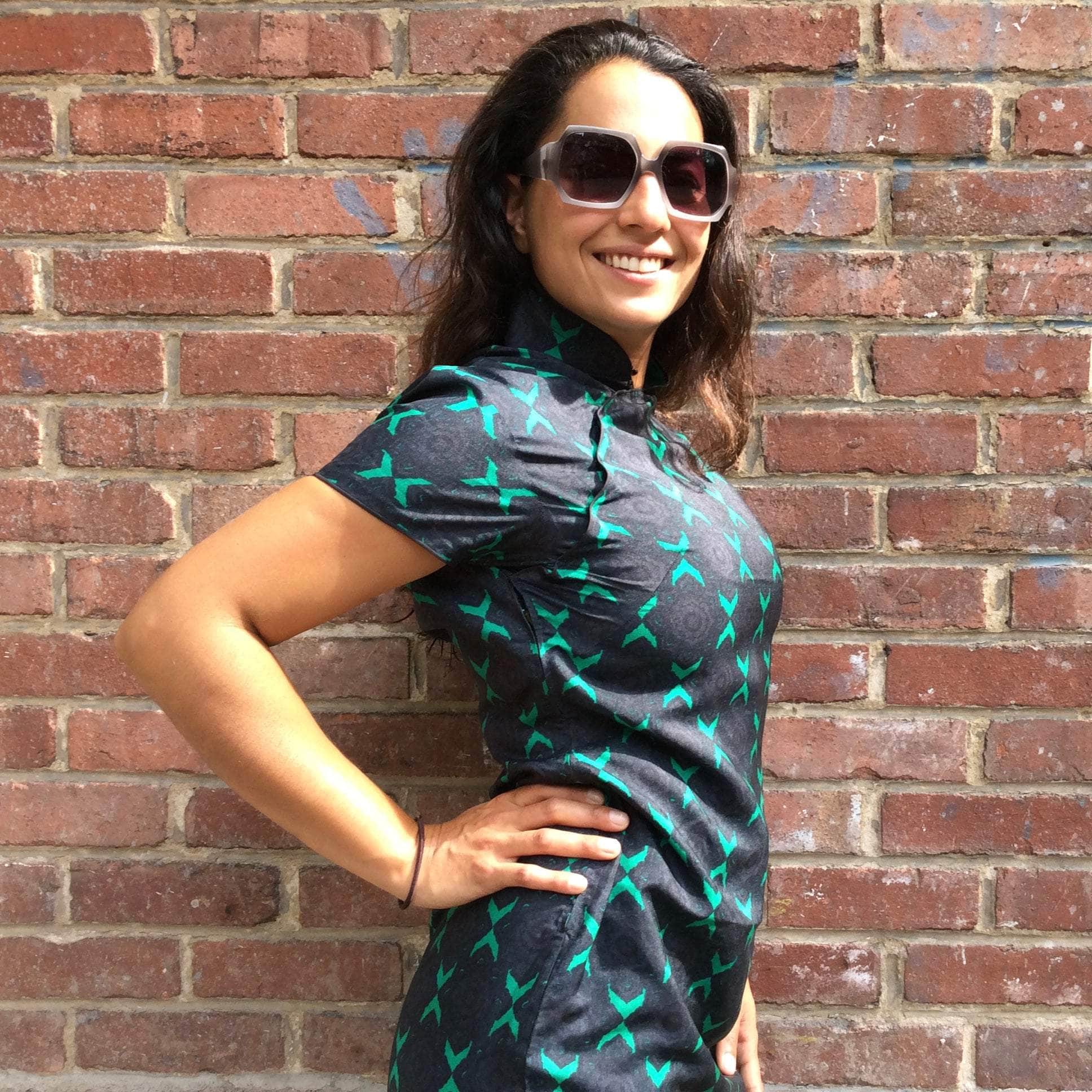 Close-up view of 1960s short sleeve blue cheongsam silk dress small-medium sold at bohemevintage.com Montreal