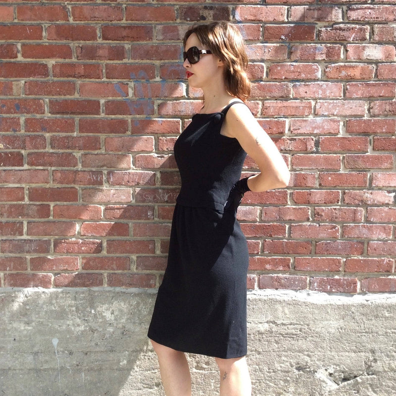 Side view of 1950s Black Sleeveless Wool Cocktail Dress size Small sold by bohemevintage.com Montréal
