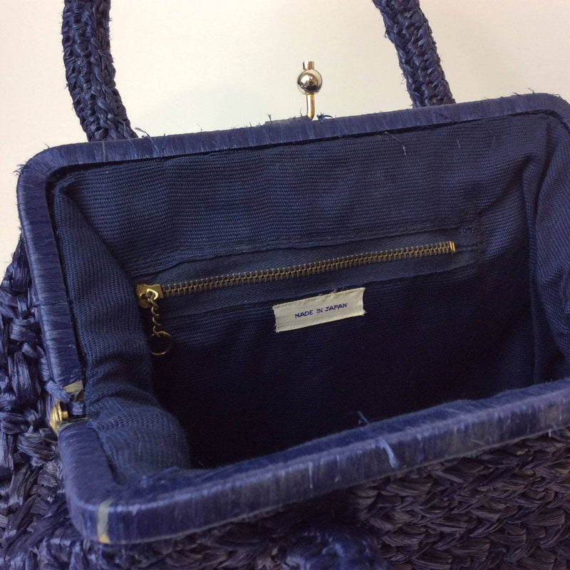 Inside  view of 1950s Midnight Blue Raffia Crocheted Frame Bag sold by bohemevintage.com Montreal