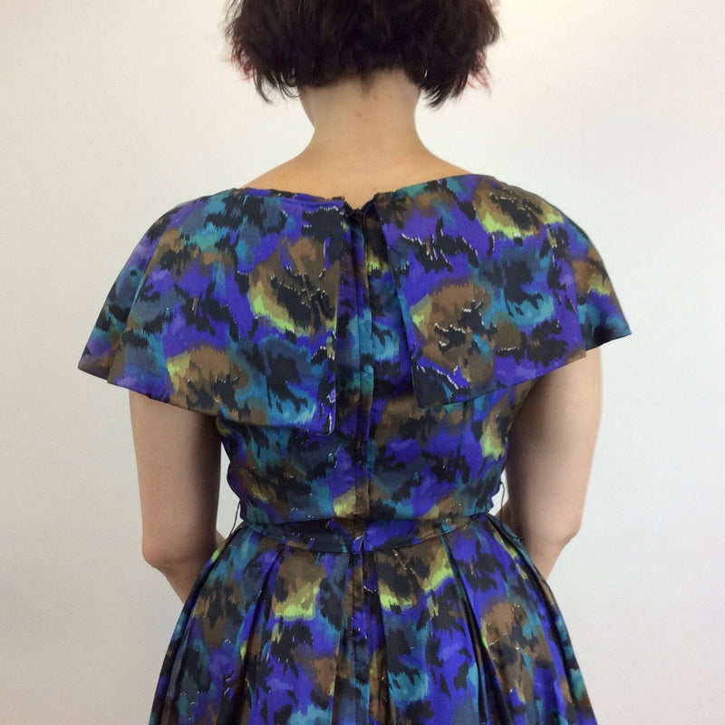  Back View of 1950s Purple Abstract Print Full Skirt , Fit and Flare Silk Dress, size Medium, sold at bohemevintage.com Montréal