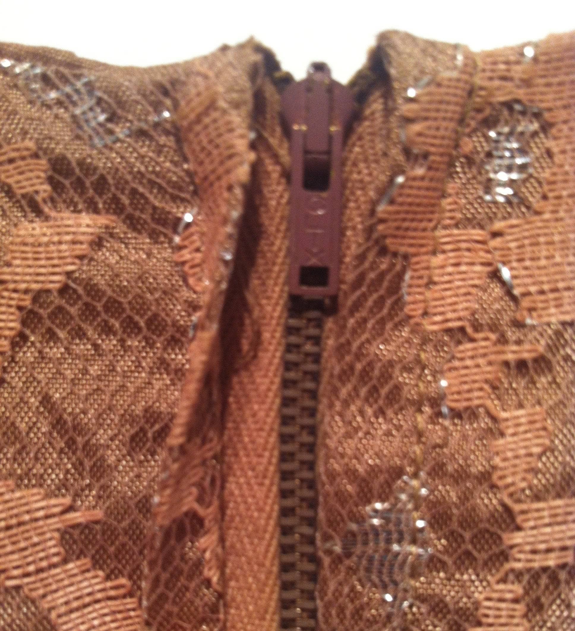 Close-up view of  Backside Zipper of 1950s Short Sleeve Latte Colour Lace Midi Dress Size Small sold by bohemevintage.com Montreal 