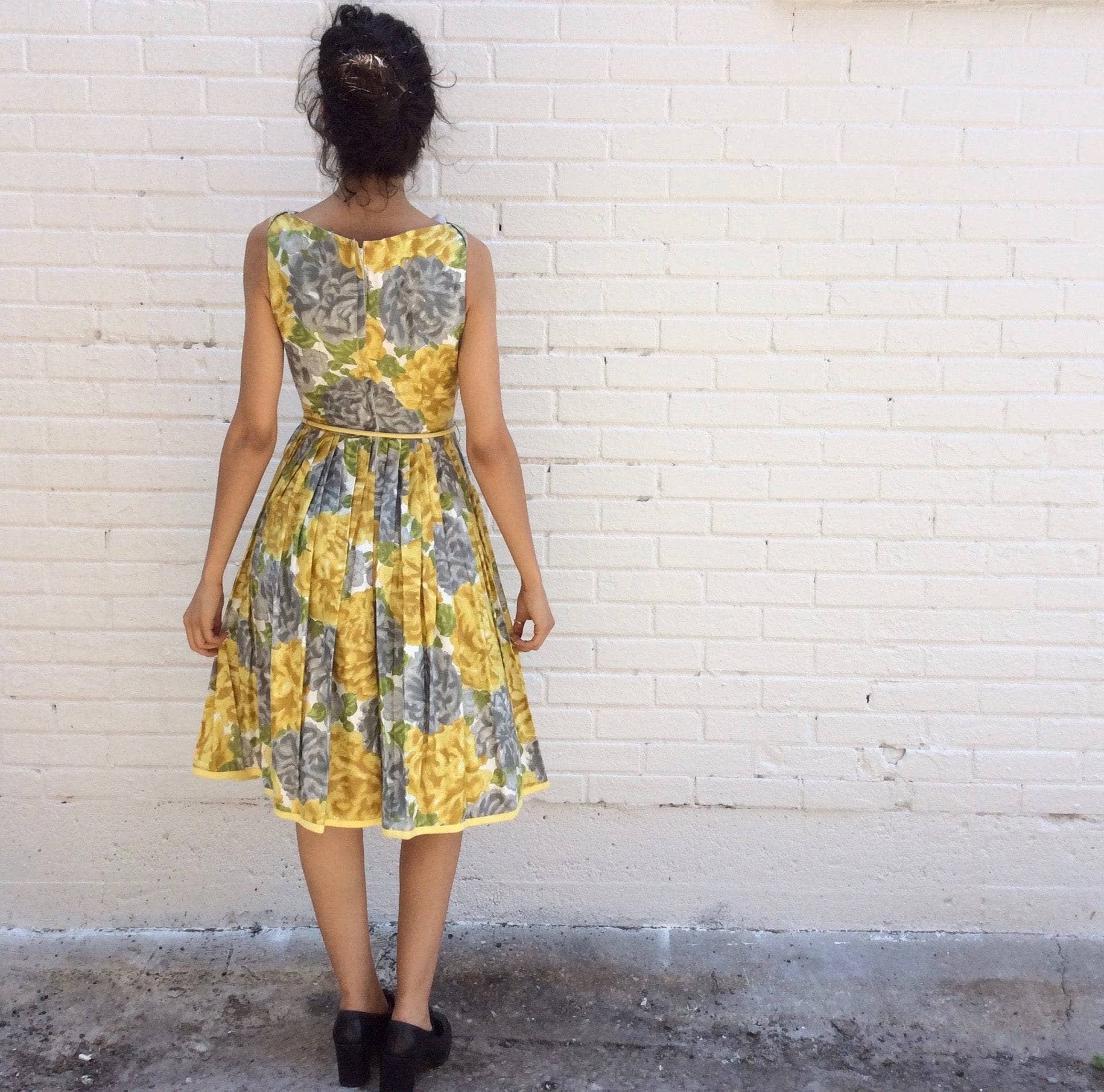 Back view of 1950s Yellow Floral Cotton Dress Size Small sold by bohemevintage.com Montreal 