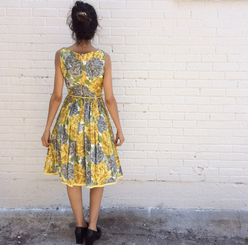 Back view of 1950s Yellow Floral Cotton Dress Size Small sold by bohemevintage.com Montreal 