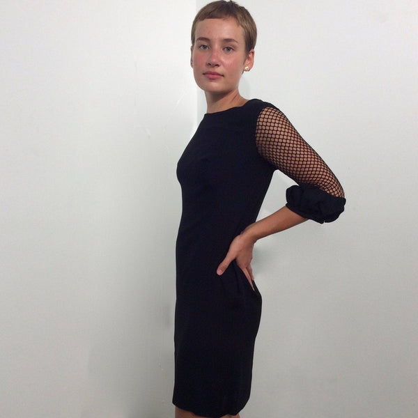 Side view of 1960s Black Mini Shift Dress with Mesh Sleeves size Small sold by bohemevintage.com Montréal