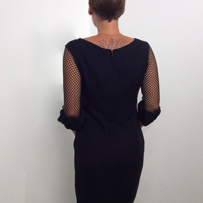 Back view of 1960s Black Mini Shift  Dress with Mesh Sleeves size Small sold by bohemevintage.com Montréal
