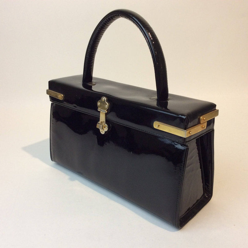 1960s Black Patent Leather Style Pillbox Handbag. Sold by bohemevintage.com Montréal