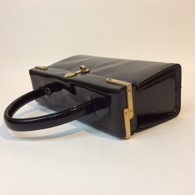 1960s Black Patent Leather Style Pillbox Handbag. Sold by bohemevintage.com Montréal