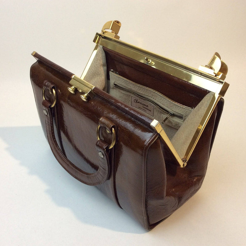 Open view of 1960s Brown Patent Leather Frame Bag with 2 handles from Charisma. sold by bohemevintage.com Montréal