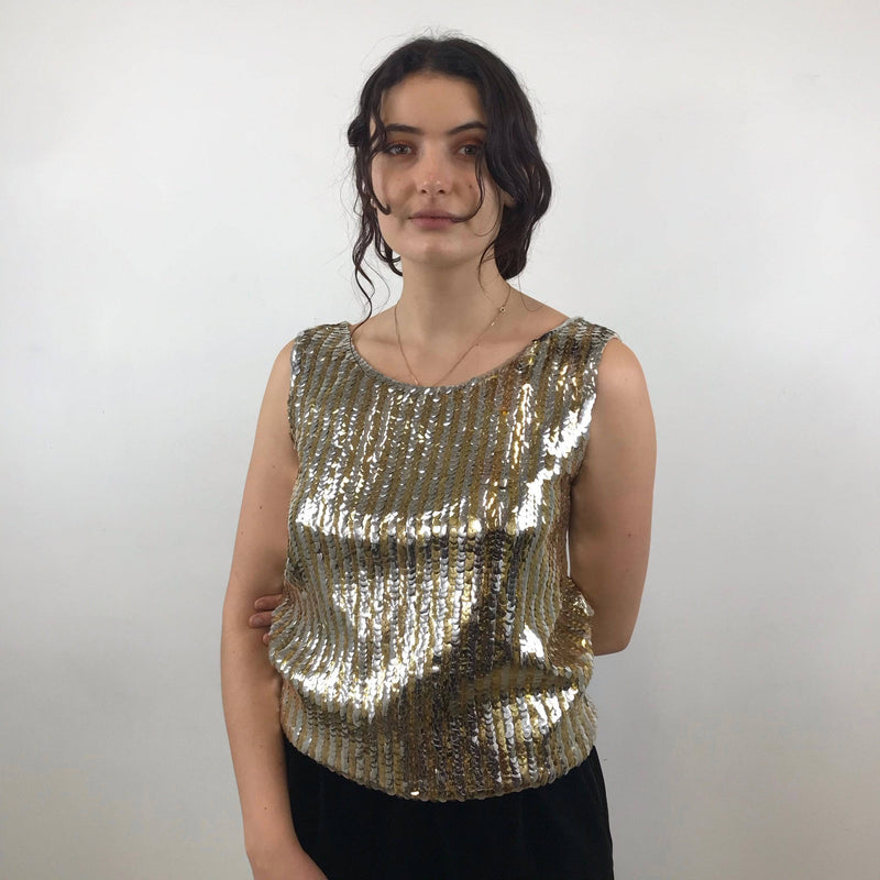 1960s Gold and Silver Sleeveless Sequin Top Size Medium - Large paired with Yves Saint Laurent black velvet skirt sold by bohemevintage.com Montreal