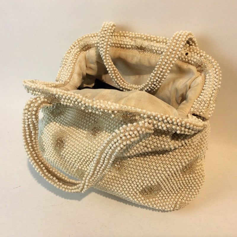 1960s Ivory Grandee Beaded Soft Shell Handbag sold by bohemevintage.com Montreal
