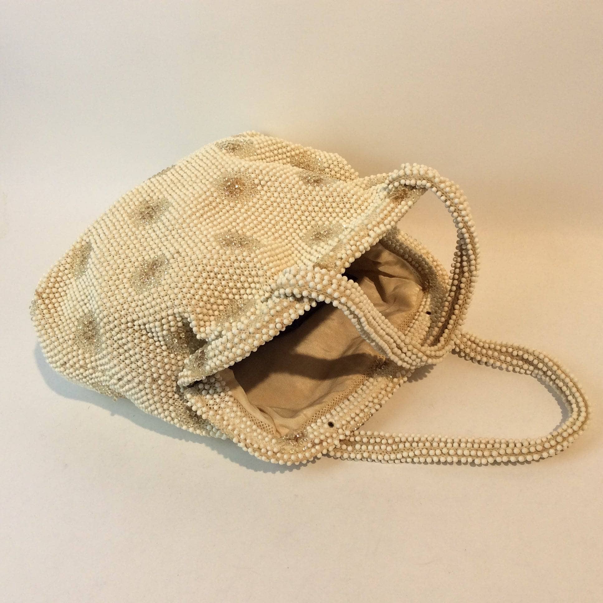 Open 1960s Ivory Grandee Beaded Soft Shell Handbag sold by bohemevintage.com Montreal