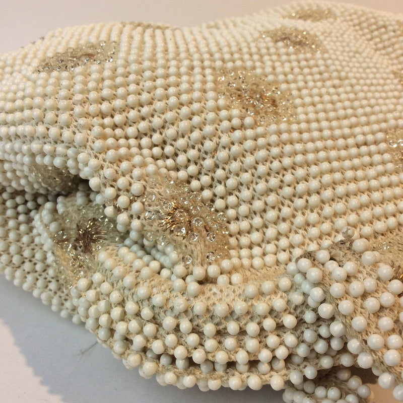 Close up view of 1960s Ivory Grandee Beaded Soft Shell Handbag sold by bohemevintage.com Montreal