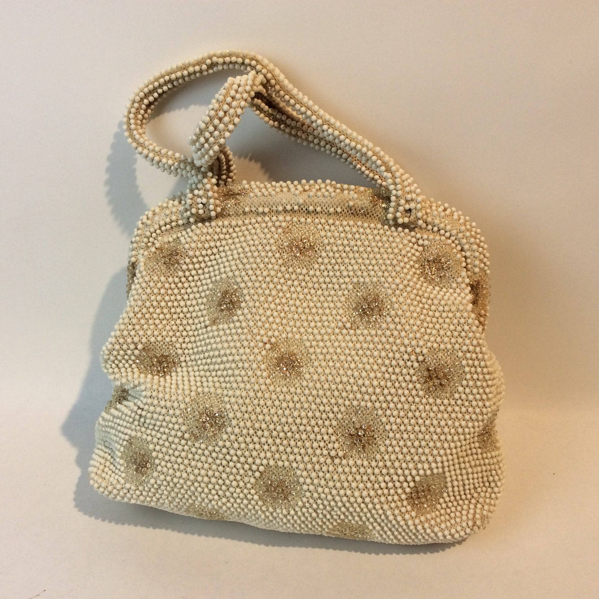 1960s Ivory Grandee Beaded Soft Shell Handbag  sold by bohemevintage.com Montreal