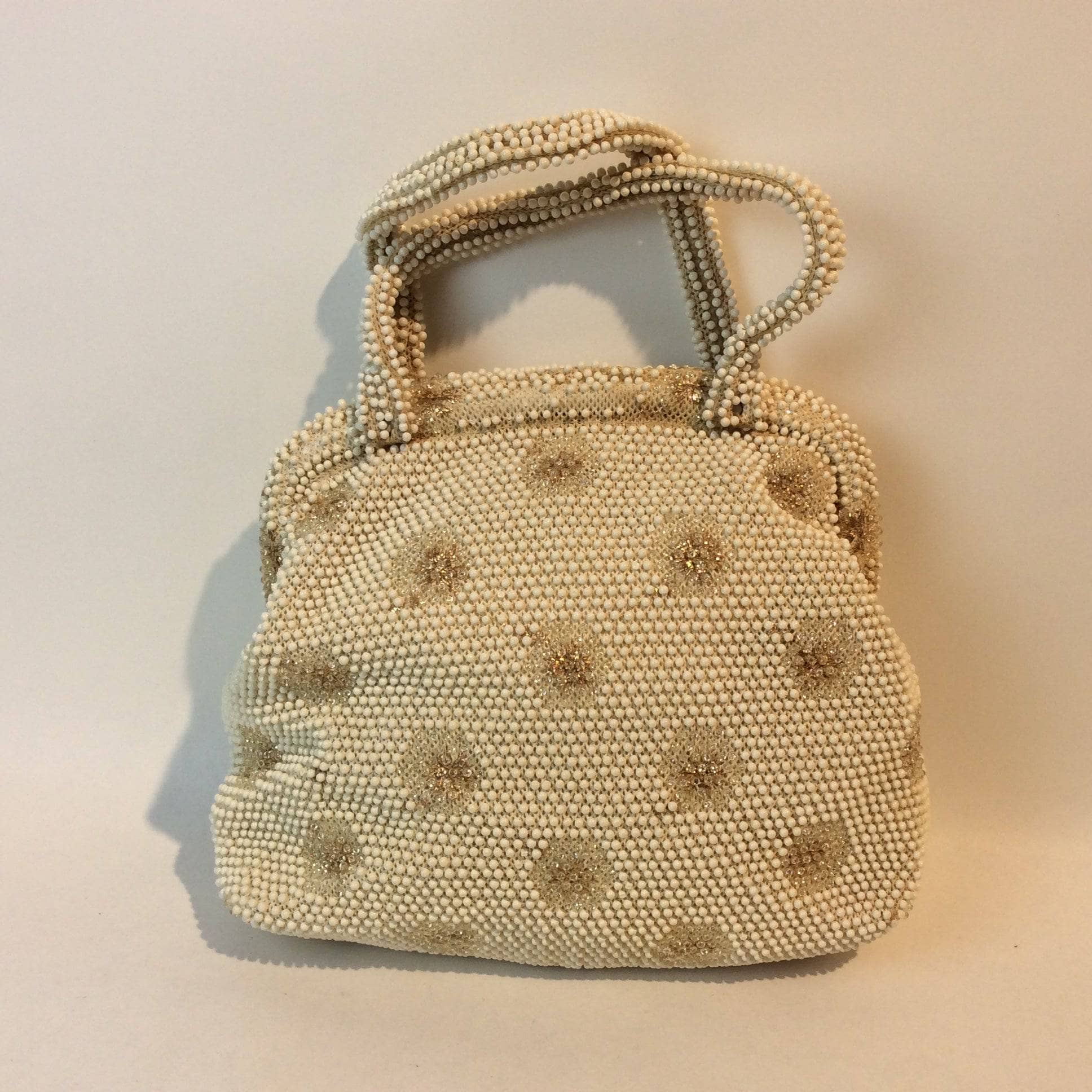 1960s Ivory Grandee Beaded Soft Shell Handbag sold by bohemevintage.com Montreal