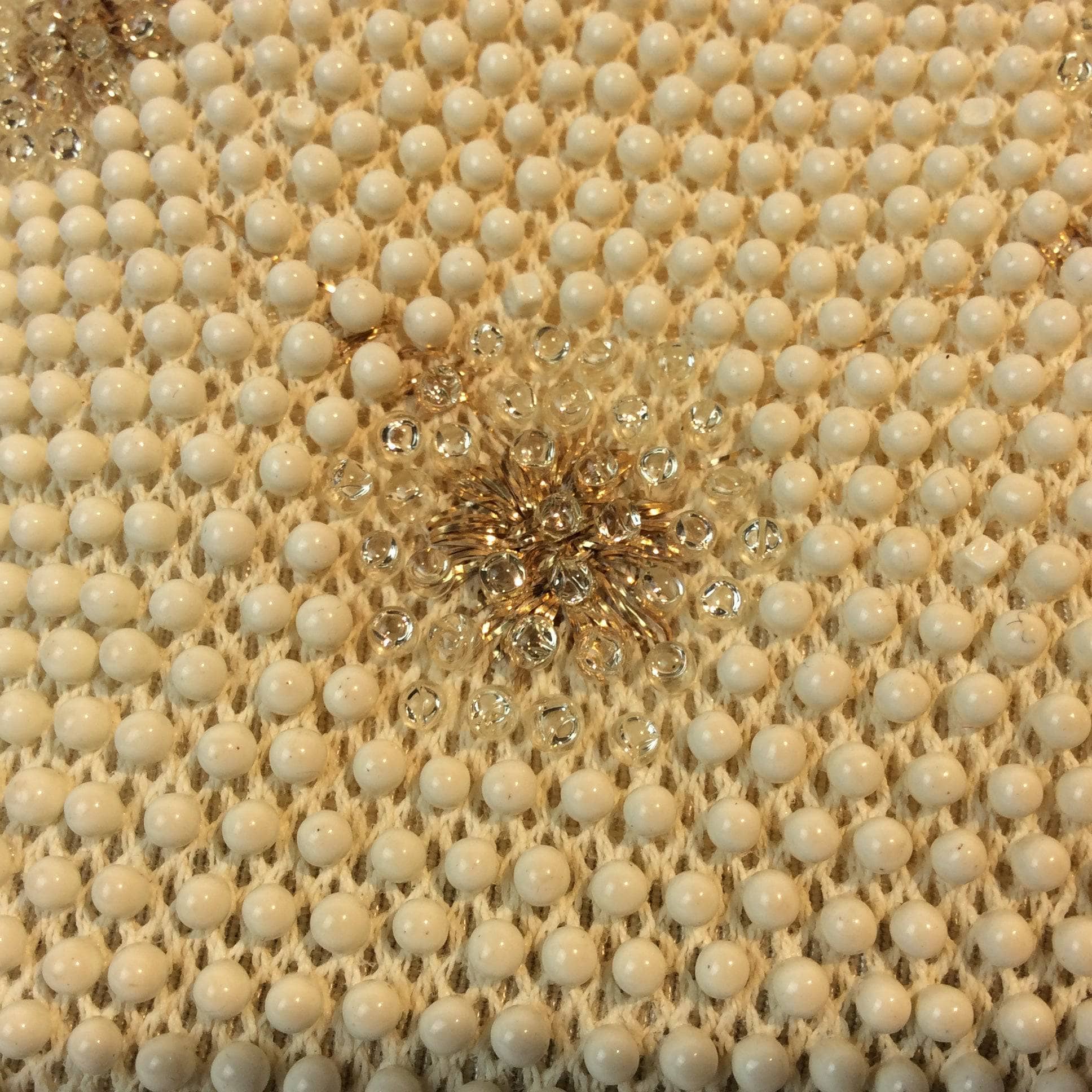 Close up view of fabric and floral motif of 1960s Ivory Grandee Beaded Soft Shell Handbag sold by bohemevintage.com Montreal
