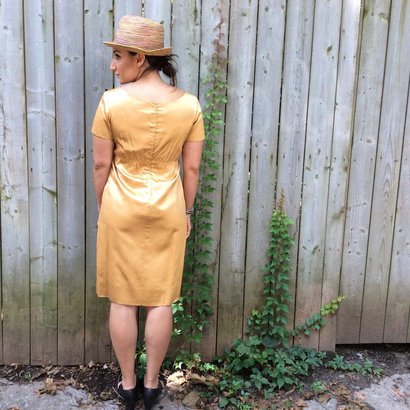 Back View of 1960s Knee-length Gold Satin Shift Dress. sold by bohemevintage.com Montréal