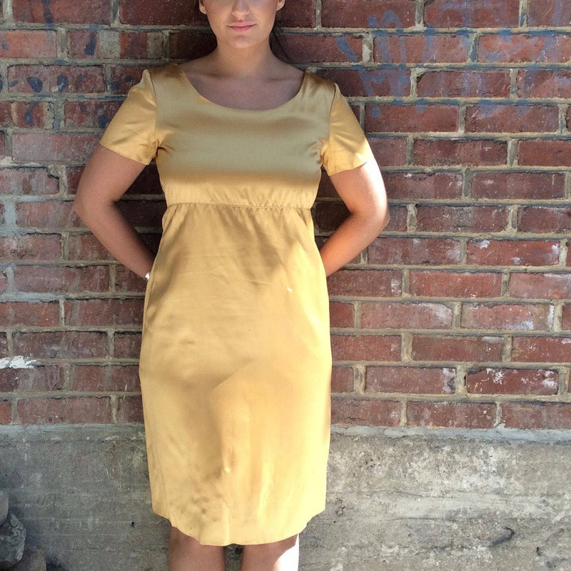 1960s Knee-length Gold Satin Shift Dress. sold by bohemevintage.com Montréal