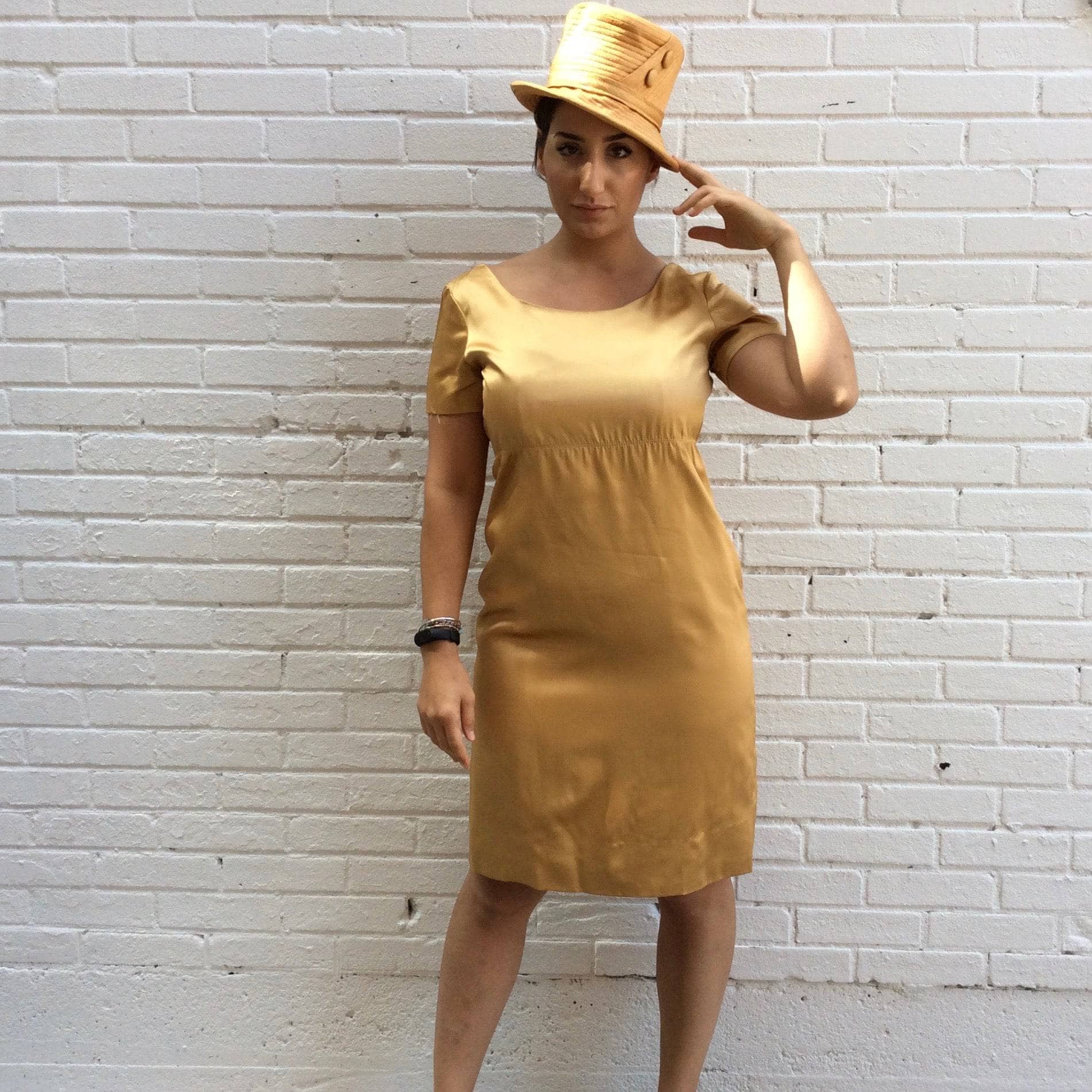 1960s Knee-length Gold Satin Shift Dress.  sold by bohemevintage.com Montréal