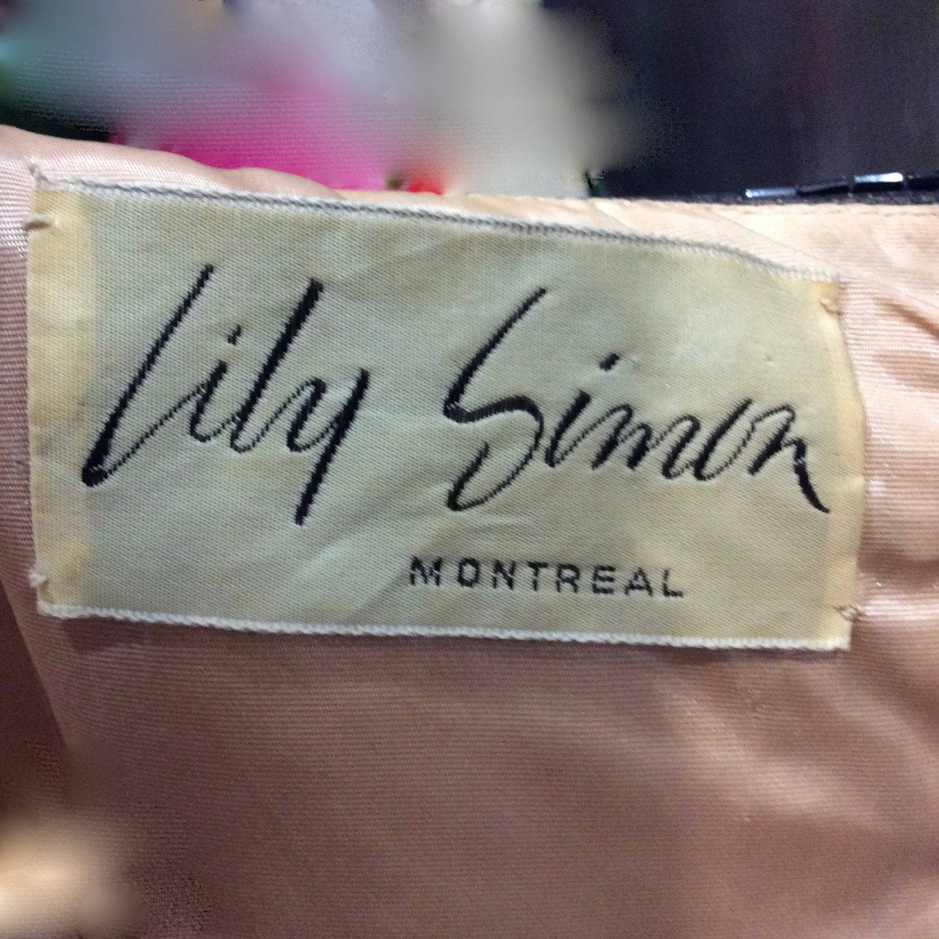 Close-Up of Lily Simon Montreal Label of 1960s "Lily Simon" Sequin and Beaded Silk Chiffon Couture Mini Dress Size Small sold by bohemevintage.com Montréal