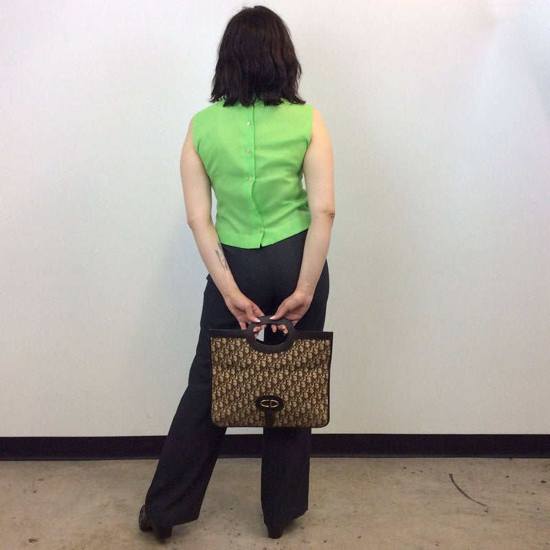 Back View of 1960s Lime Green Sleeveless Cropped Blouse with Jabot Collar. Sold by bohemevintage.com Montréal