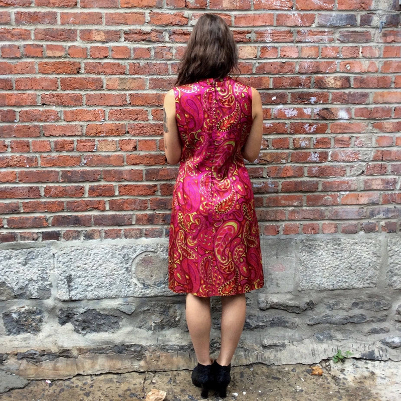 Back view of Vintage, Handmade 1960s Paisley Bold Print Shift Dress Size Small/Medium. Sold by bohemevintage.com Montreal