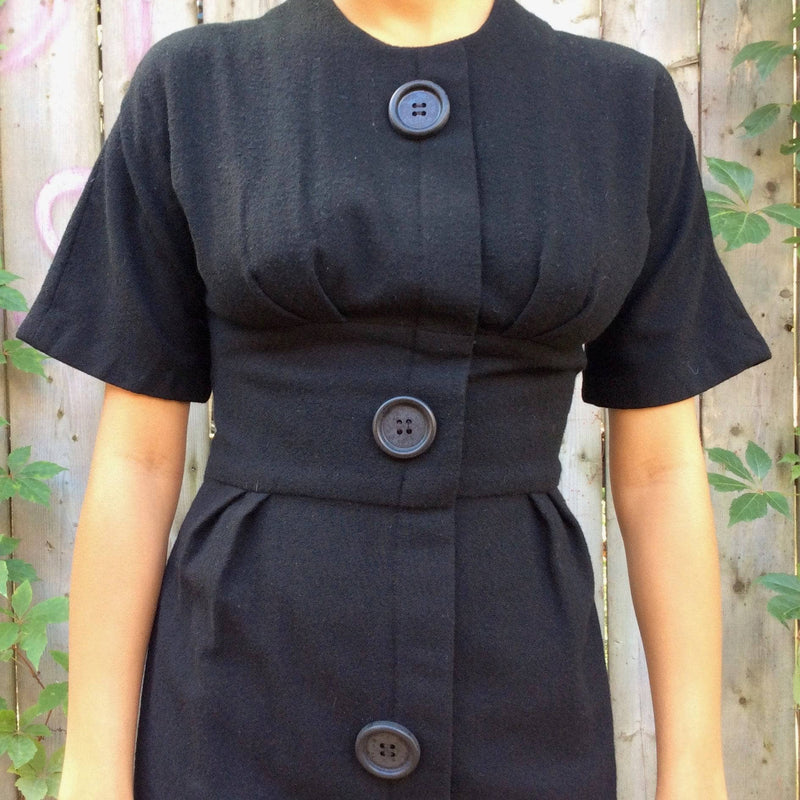  Waist View of 1960s Short Sleeve Black Wool Dress Size Small sold by bohemevintage.com Montreal
