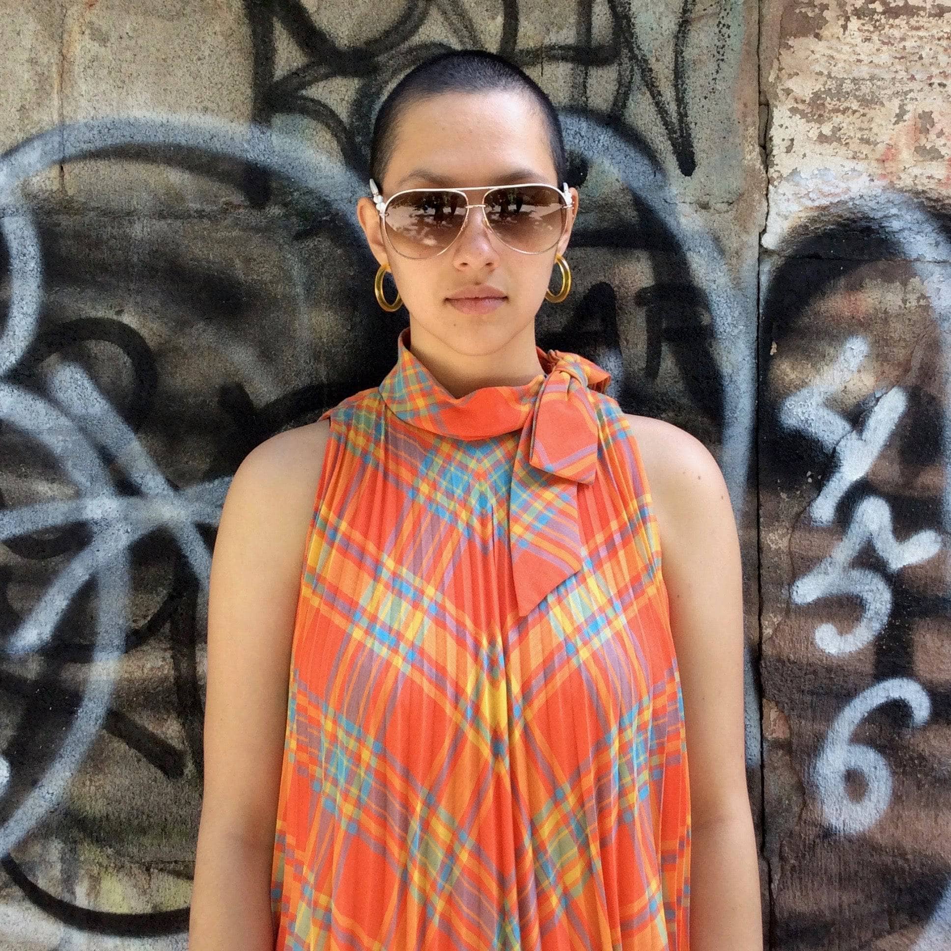 Close-Up of top of 1960s Sunburst Pleated Tent Dress Size Small/Medium. Sold by bohemevintage.com Montreal