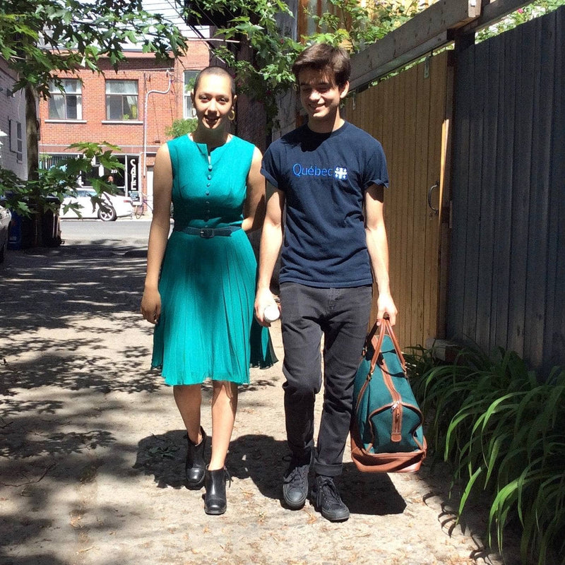 outside picture with boyfriend wearing a 1960s Teal Chiffon Cocktail Dress Size Small-Medium sold by bohemevntage.com Montréal