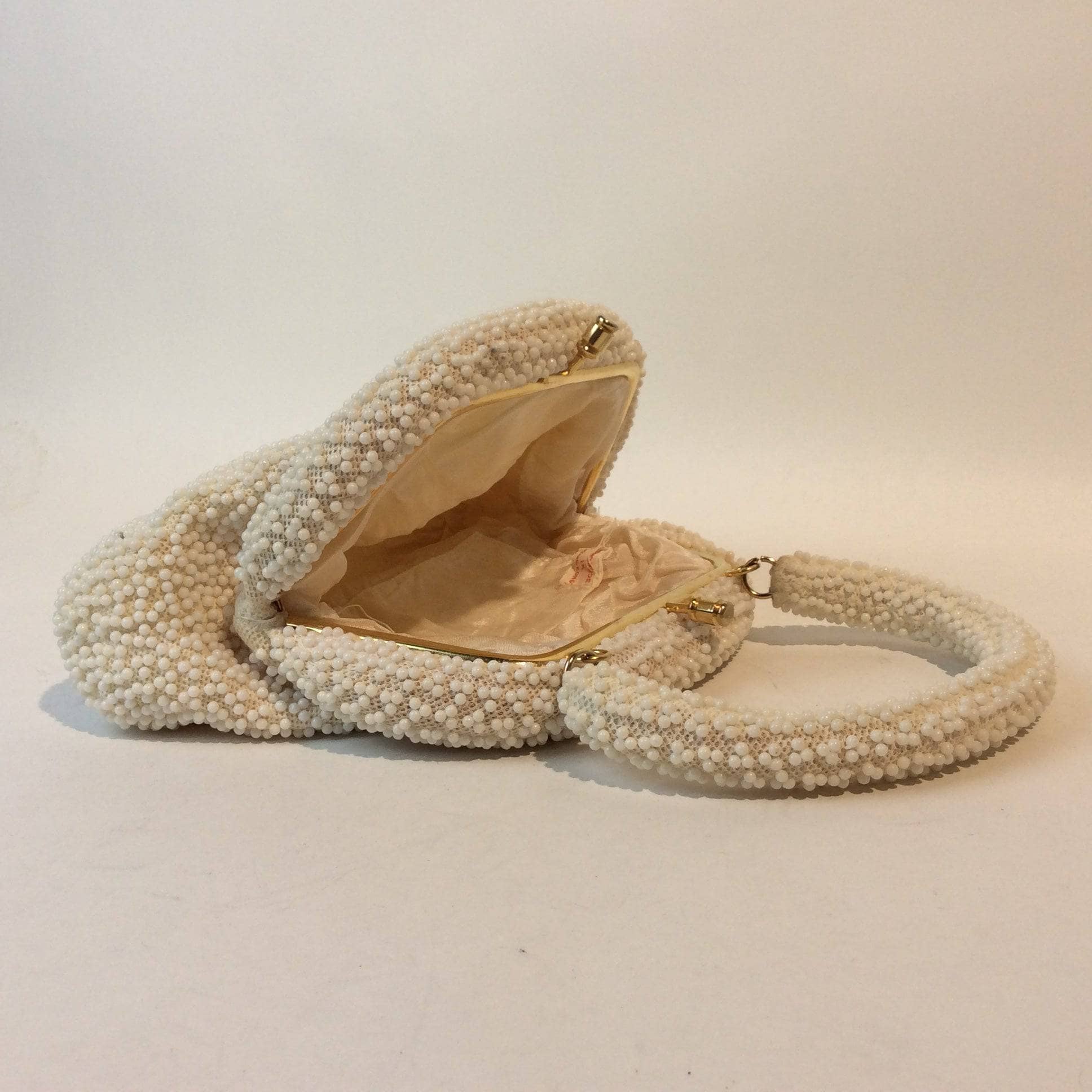 Open view of Corde-Bead 1960s White Beaded Soft Shell Evening Bag. Sold by bohemevintage.com Montreal