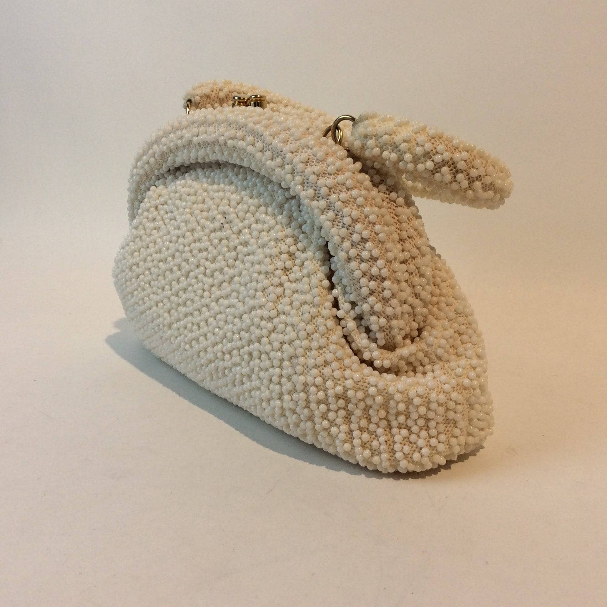 Corde-Bead 1960s White Beaded Soft Shell Evening Bag. Sold by bohemevintage.com Montreal