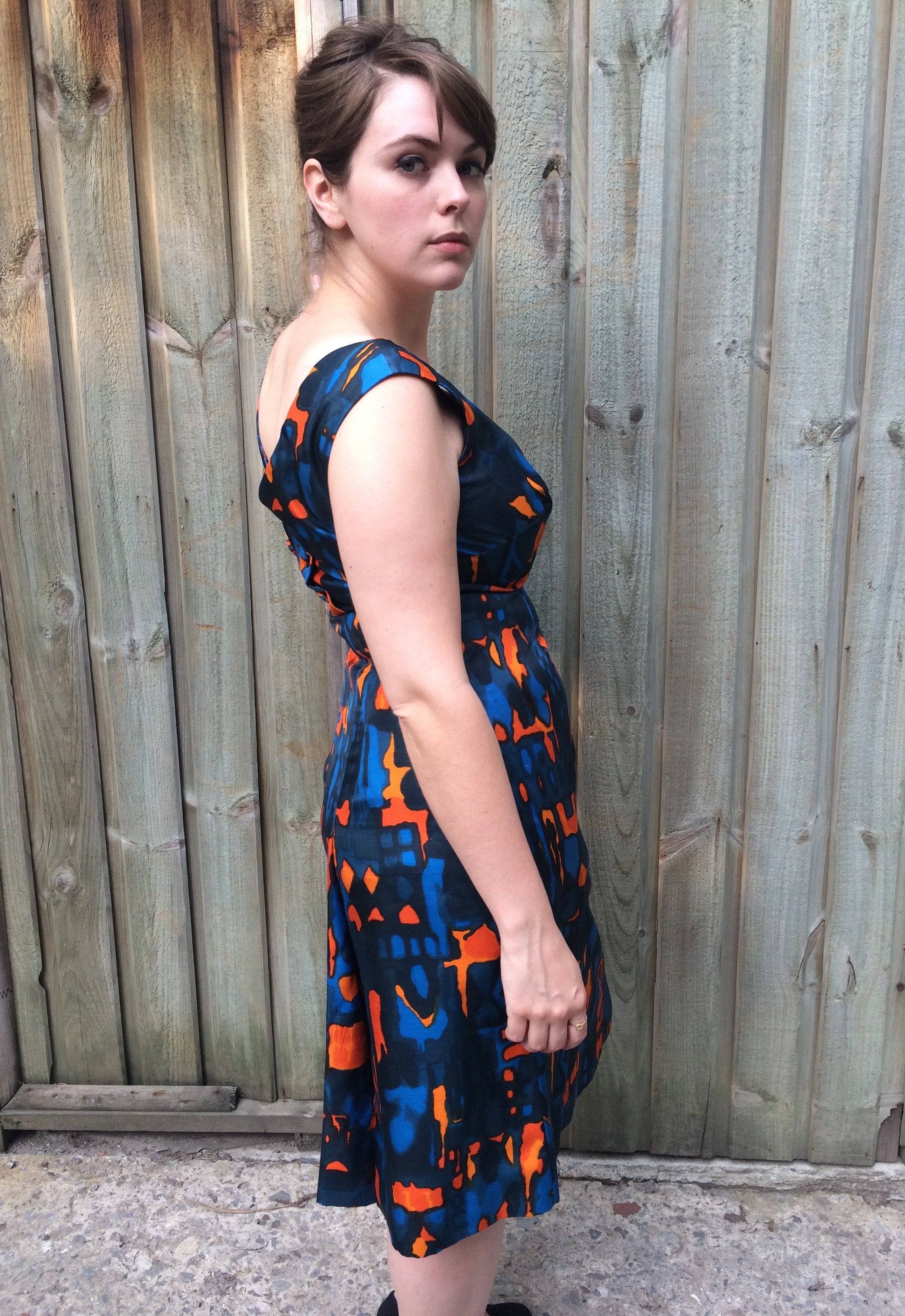 Side view of 1960s Wrap Back Sleeveless Silk Cocktail Dress Size Medium sold by bohemevintage.com Montréal