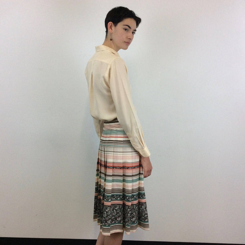 Side view of Mister Leonard 1970s Bold Print Pleated Cotton Skirt Size Small sold by bohemevintage.com