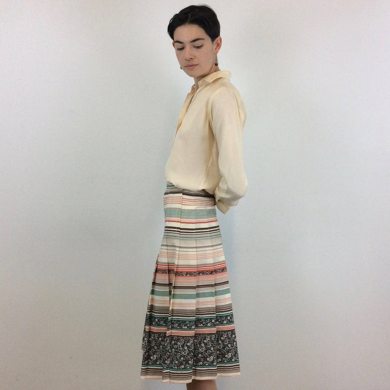 Side view of Mister Leonard 1970s Bold Print Pleated Cotton Skirt Size Small sold by bohemevintage.com