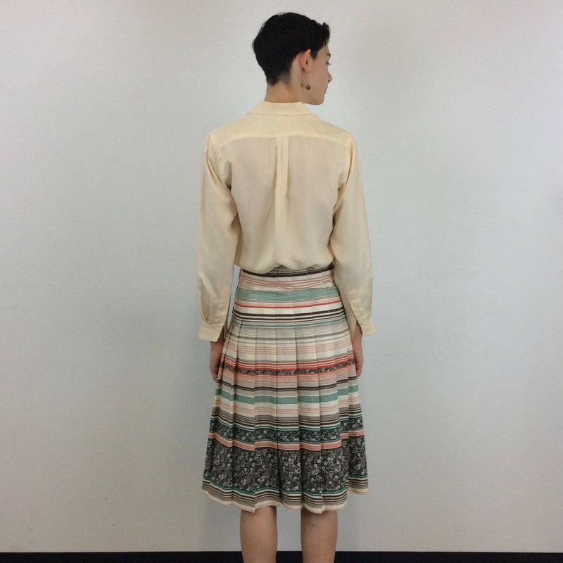 Back view of Mister Leonard 1970s Bold Print Pleated Cotton Skirt Size Small sold by bohemevintage.com