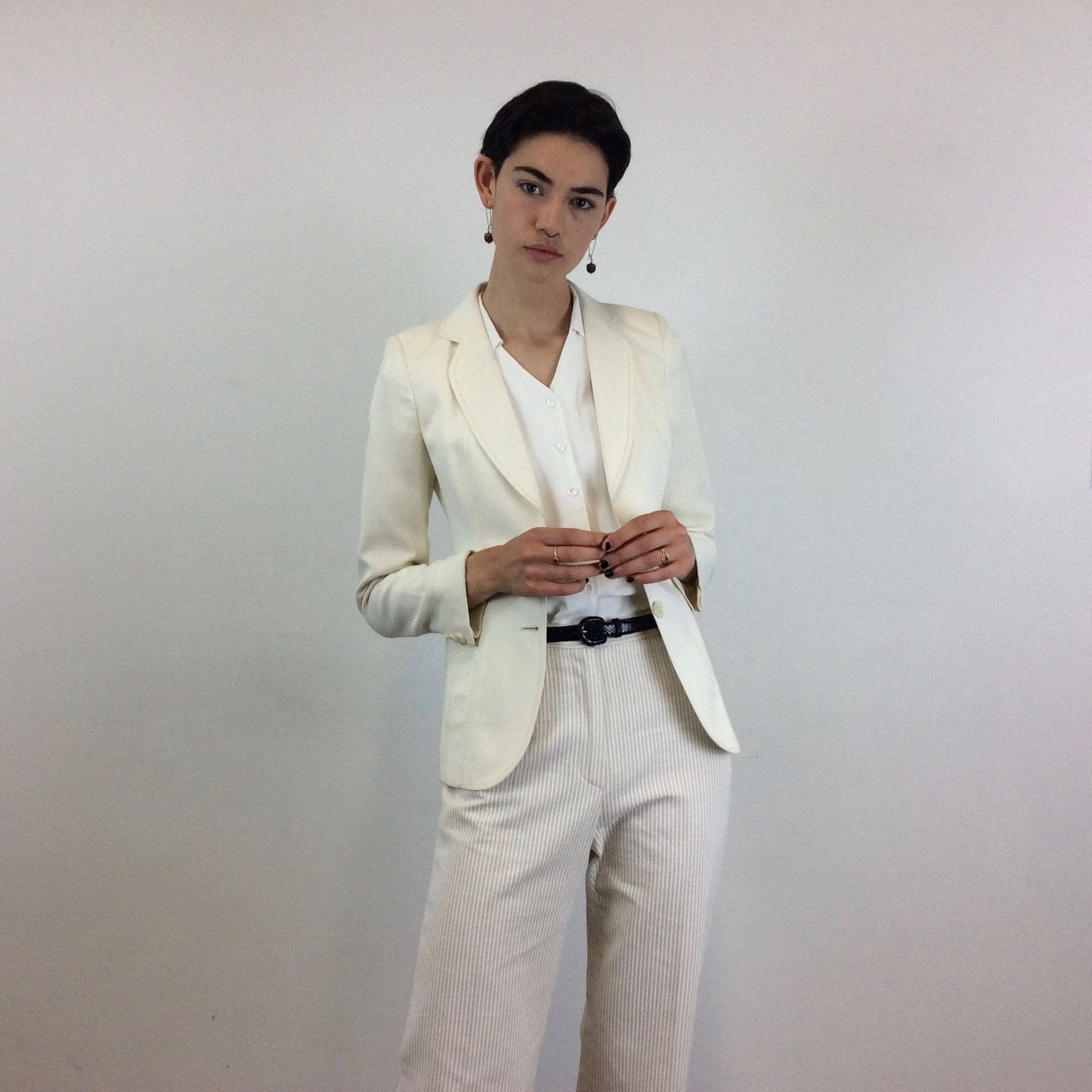 Front view of 1970s Cotton and Linen Wide Leg Pants Size Small paired with cream white blazer sold by bohemevintage.com Montreal